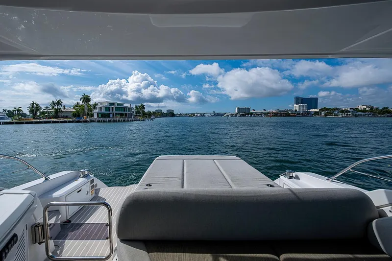 Slide: The Image of View from 2019 Azimut Atlantis 51 yacht, overlooking serene waterfront and luxury homes. - 13
