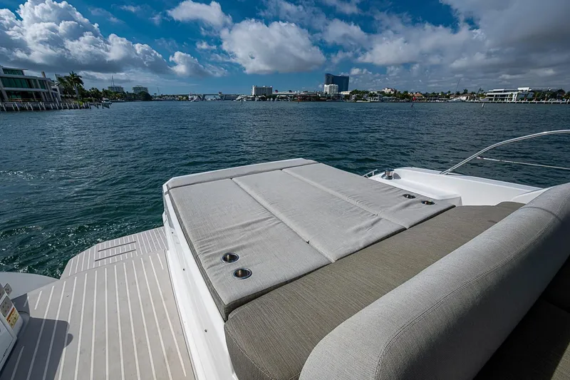 Slide: The Image of Luxurious 2019 Azimut Atlantis 51 yacht with spacious sun deck, overlooking serene waterfront. - 14