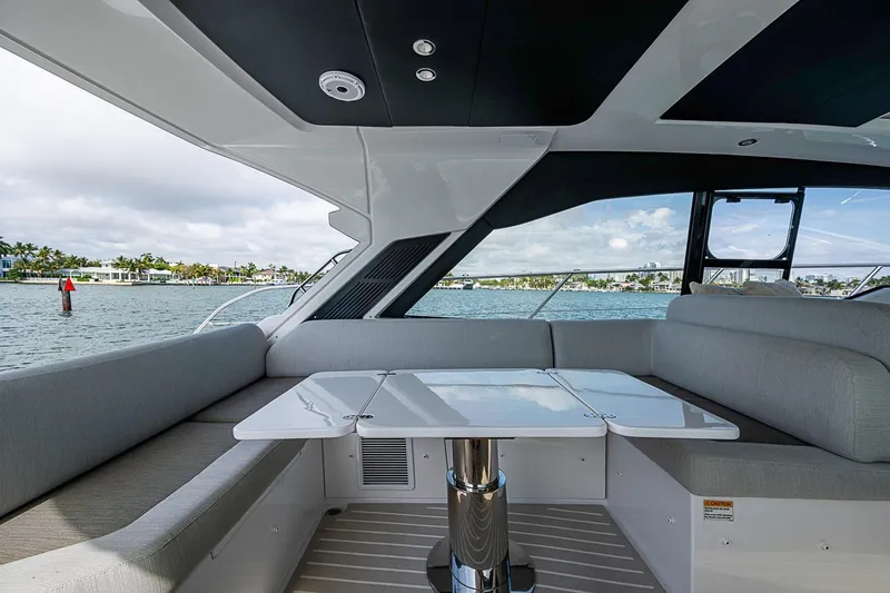 Slide: The Image of Luxurious seating area on 2019 Azimut Atlantis 51 yacht with waterfront view. - 22