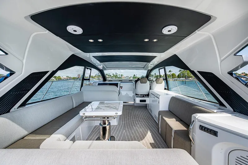 Slide: The Image of Luxurious interior of 2019 Azimut Atlantis 51 yacht with modern seating and panoramic windows. - 26