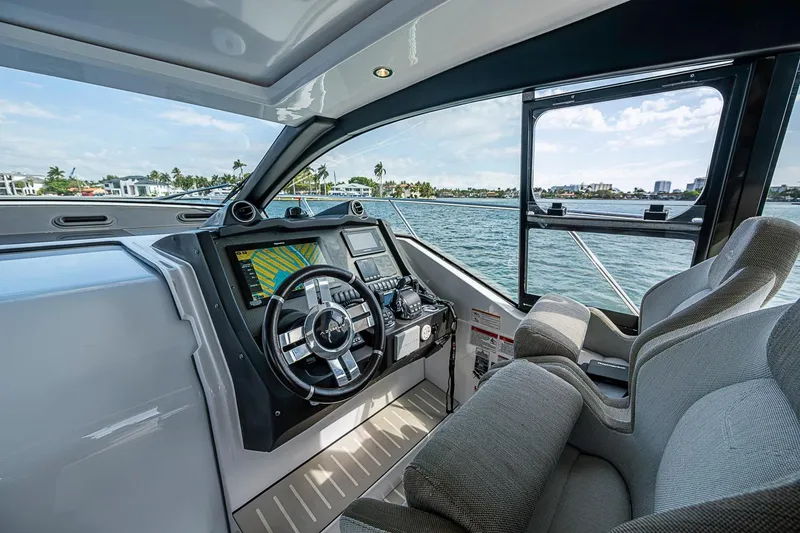 Slide: The Image of Cockpit view of 2019 Azimut Atlantis 51 yacht with modern navigation equipment. - 27