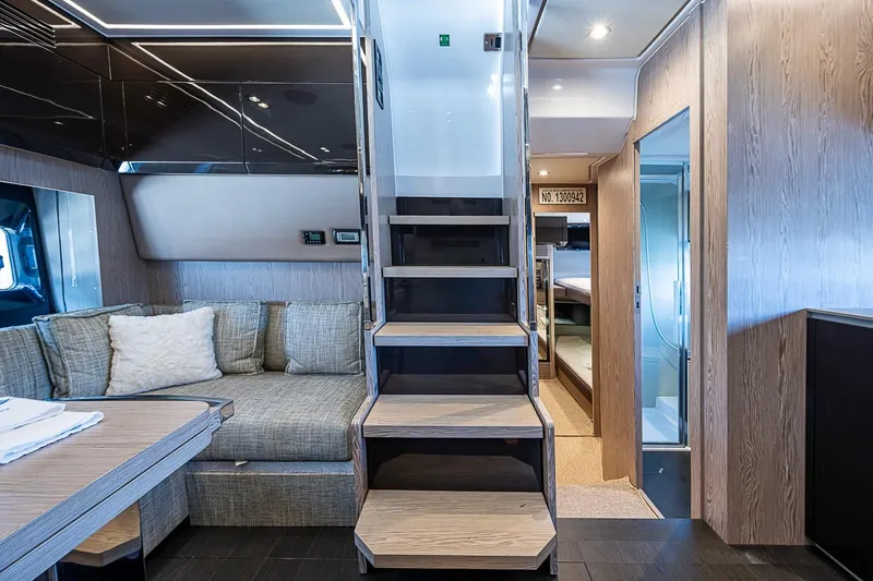 Slide: The Image of Luxurious interior of 2019 Azimut Atlantis 51 yacht with modern staircase and cozy seating area. - 33