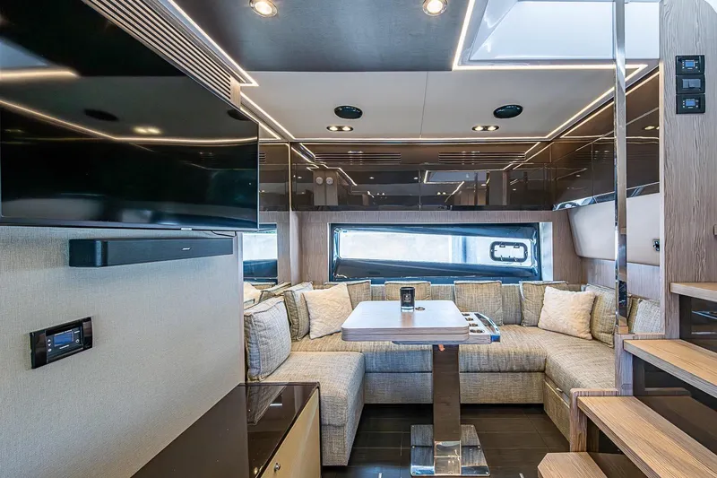 Slide: The Image of Luxurious interior of 2019 Azimut Atlantis 51 yacht with modern seating and entertainment area. - 34