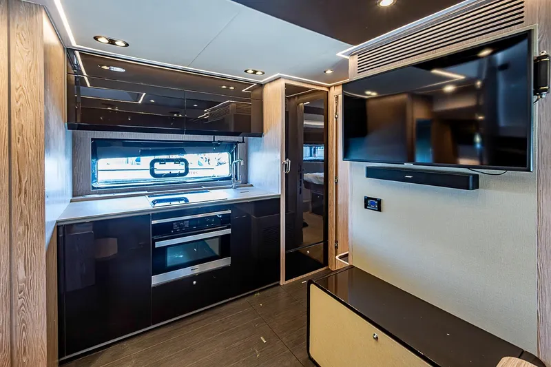 Slide: The Image of Luxurious interior of 2019 Azimut Atlantis 51 yacht with modern kitchen and entertainment area. - 36