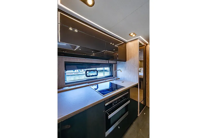 Slide: The Image of Modern kitchen interior of 2019 Azimut Atlantis 51 yacht with sleek design and appliances. - 37