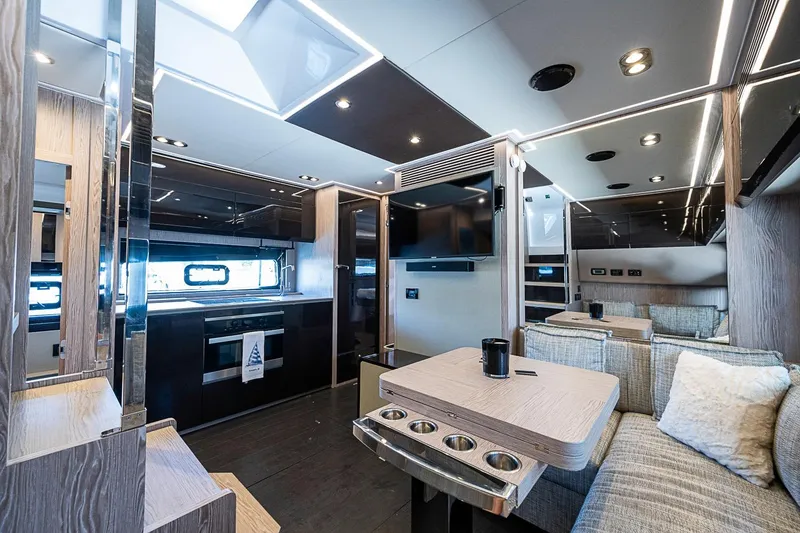 Slide: The Image of Luxurious interior of 2019 Azimut Atlantis 51 yacht with modern kitchen and seating area. - 39