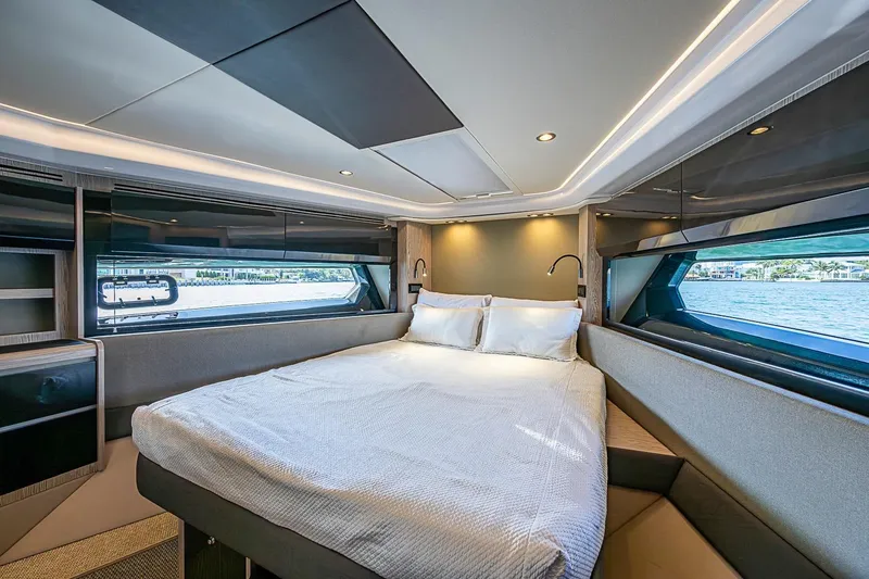 Slide: The Image of Luxurious bedroom interior of 2019 Azimut Atlantis 51 yacht with scenic window views. - 49