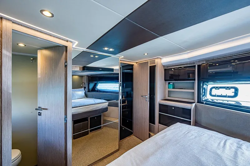 Slide: The Image of Luxurious interior of 2019 Azimut Atlantis 51 yacht, featuring modern bedroom and sleek design. - 52