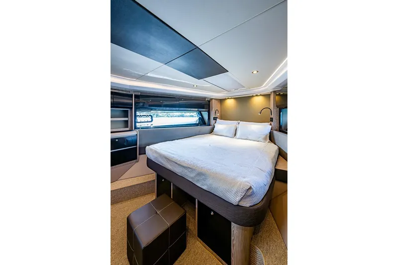 Slide: The Image of Luxurious bedroom interior of 2019 Azimut Atlantis 51 yacht, featuring modern design and cozy bedding. - 53