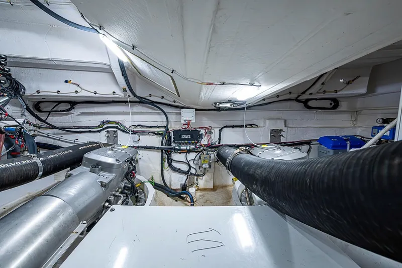 Slide: The Image of Engine room of 2019 Azimut Atlantis 51 yacht, showcasing mechanical components and wiring. - 60