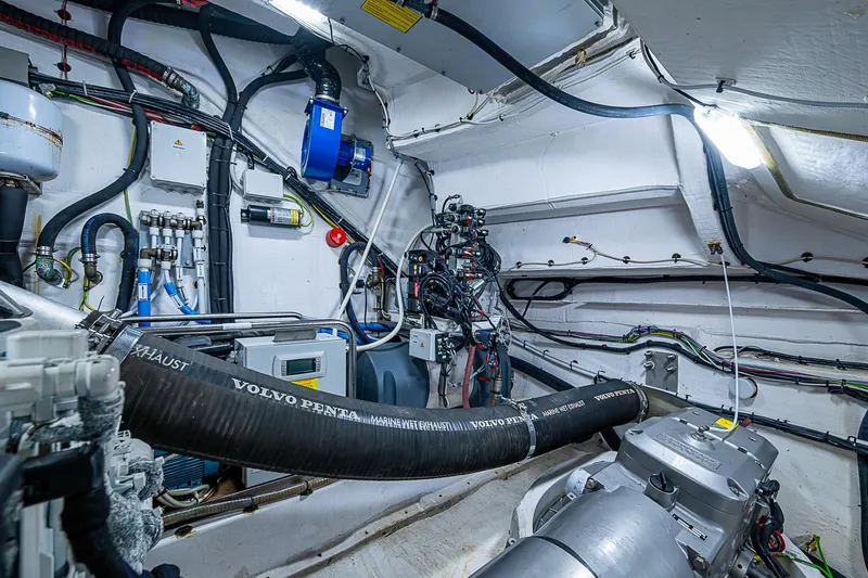 Slide: The Image of Engine room of 2019 Azimut Atlantis 51 yacht, featuring Volvo Penta components and complex wiring. - 61