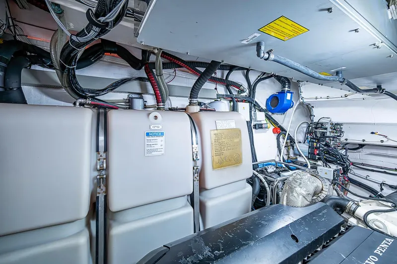 Slide: The Image of Engine room of 2019 Azimut Atlantis 51 yacht, showcasing machinery and wiring. - 67