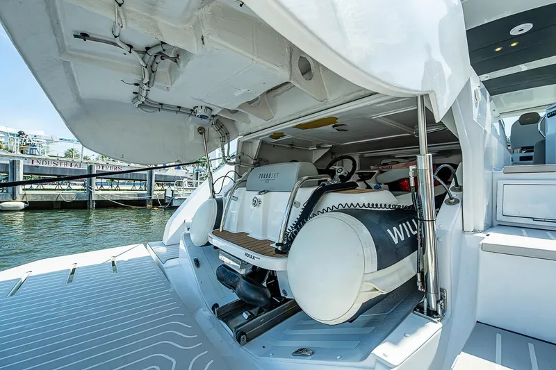 Slide: The Image of 2019 Azimut Atlantis 51 yacht with open garage and stored watercraft. - 68