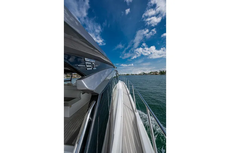 Slide: The Image of 2019 Azimut Atlantis 51 yacht cruising on a sunny day with blue skies. - 8