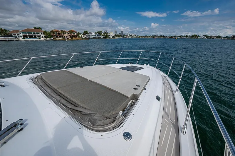 Slide: The Image of 2019 Azimut Atlantis 51 yacht with spacious deck, cruising on serene waters. - 9