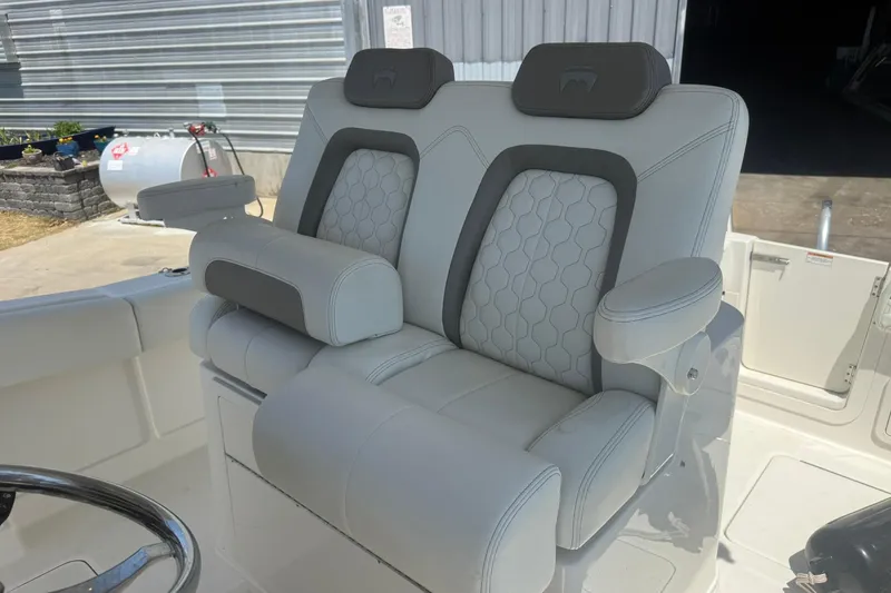 Slide: The Image of Luxury seating on 2020 World Cat 280 CC-X boat, featuring dual cushioned seats and armrests. - 15