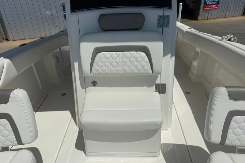 Slide: The Image of 2020 World Cat 280 CC-X boat interior with white cushioned seating. - 22