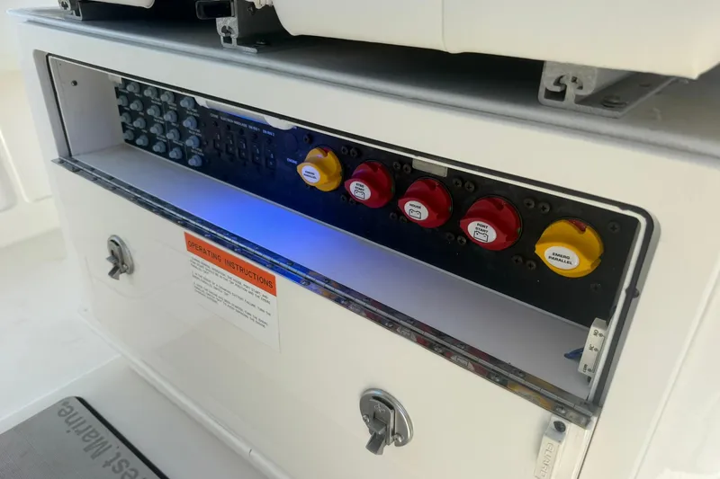 Slide: The Image of Control panel of a 2020 World Cat 280 CC-X boat with labeled switches. - 24
