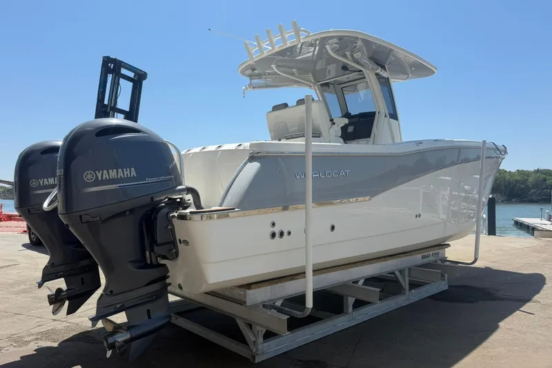 Slide: The Image of 2020 World Cat 280 CC-X boat with dual Yamaha engines on a dock. - 5
