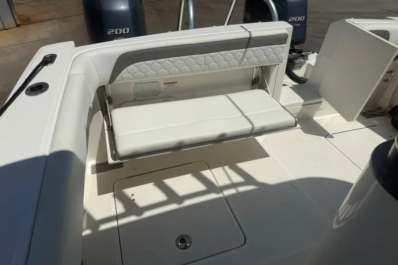 Slide: The Image of 2020 World Cat 280 CC-X boat interior with foldable seating and twin 200 engines. - 8