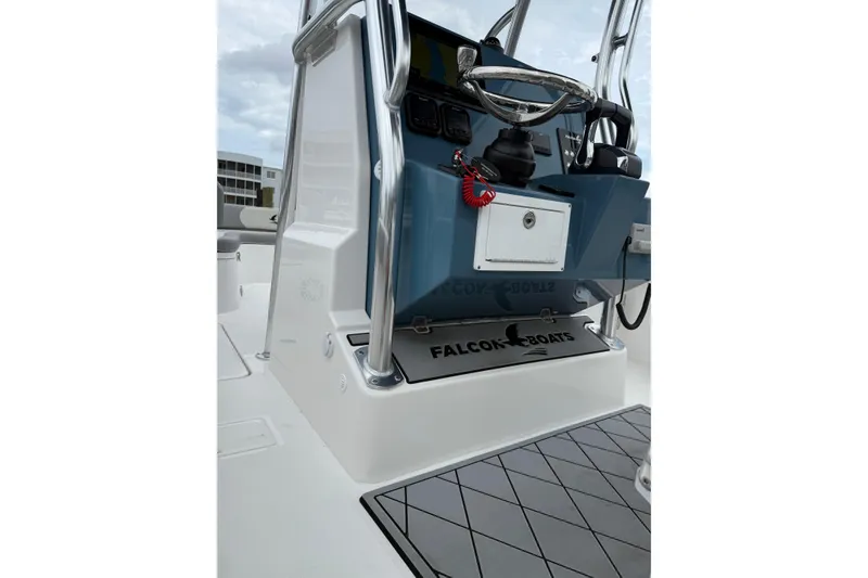 Slide: The Image of 2026 Falcon Boats 26 cockpit with steering wheel and control panel. - 10