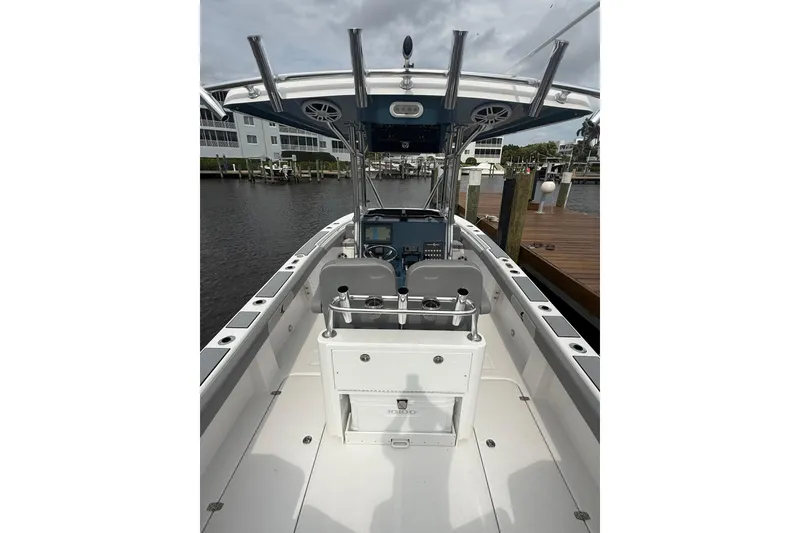 Slide: The Image of 2026 Falcon Boats 26 model, sleek interior view at marina dock. - 12