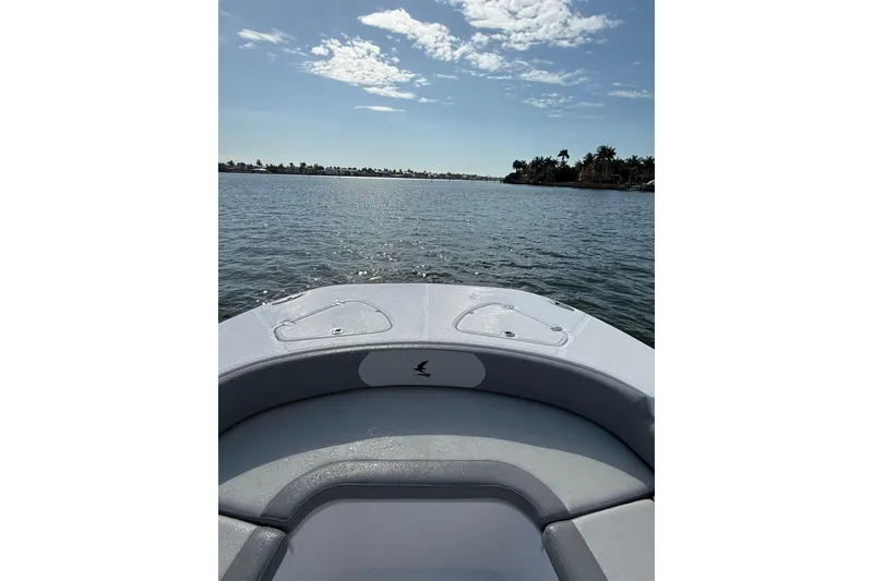 Slide: The Image of Bow view of 2026 Falcon Boats 26 on a sunny day, calm waters ahead. - 8