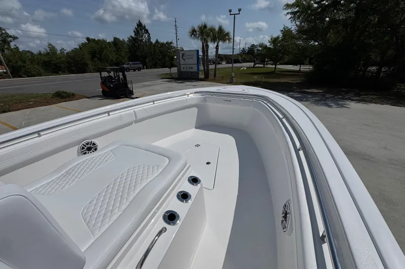 Slide: The Image of 2026 Caymas 291 boat with sleek white interior and diamond-stitched seating. - 17