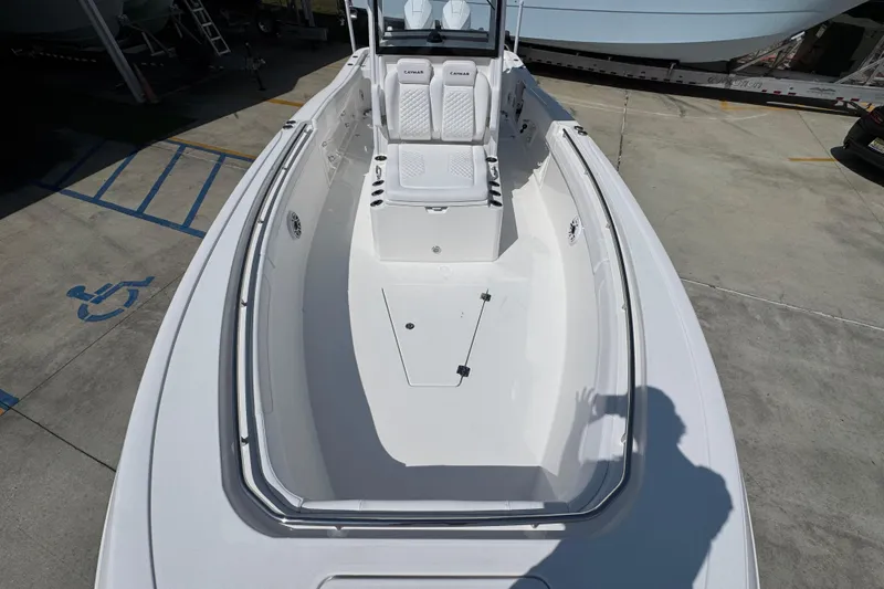 Slide: The Image of 2026 Caymas 291 boat interior with white seating and spacious deck. - 20