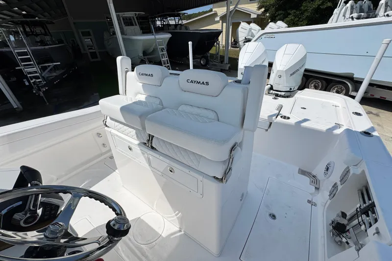 Slide: The Image of 2026 Caymas 291 boat interior with dual seats and Mercury engines. - 25