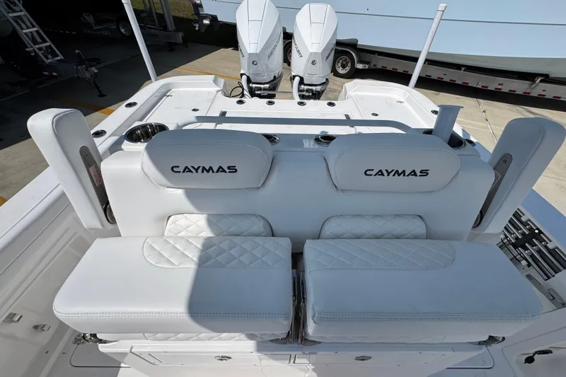Slide: The Image of 2026 Caymas 291 boat with dual engines and luxurious white seating. - 26