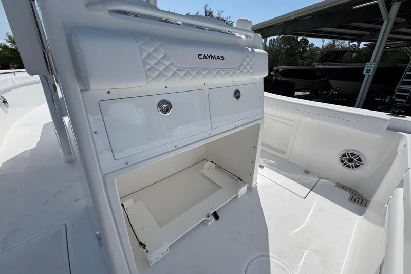 Slide: The Image of 2026 Caymas 291 boat interior with storage compartments and sleek white design. - 33