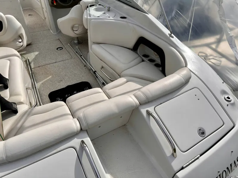 Slide: The Image of Interior of a 2005 Crownline 270 BR boat with white seating. - 10