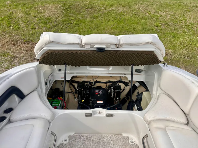 Slide: The Image of Engine compartment of a 2005 Crownline 270 BR boat, open seating area. - 11