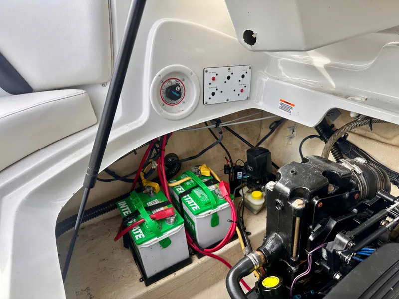 Slide: The Image of Engine compartment of 2005 Crownline 270 BR with batteries and wiring. - 14