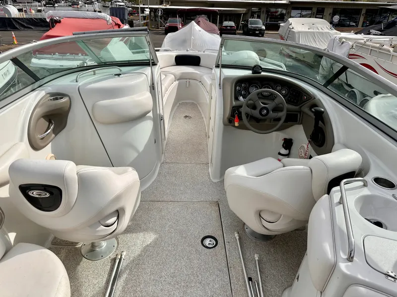 Slide: The Image of Interior of a 2005 Crownline 270 BR boat with helm station. - 15