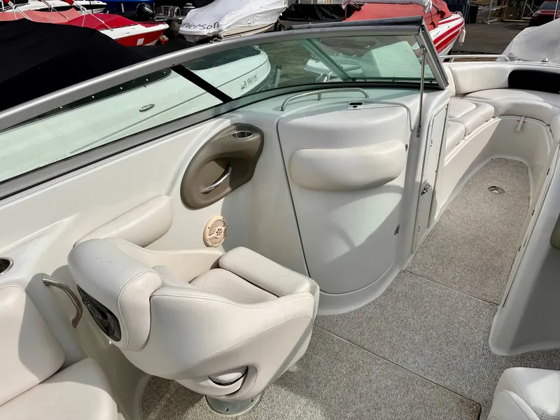 Slide: The Image of Interior of a 2005 Crownline 270 BR boat with white seating. - 16