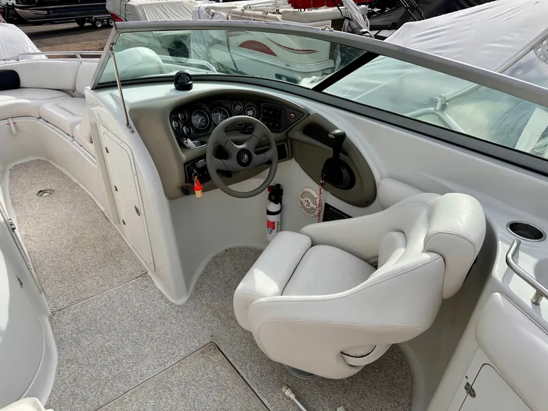 Slide: The Image of Interior of a 2005 Crownline 270 BR boat with helm console. - 17