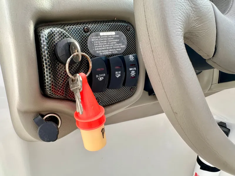 Slide: The Image of Dashboard of a 2005 Crownline 270 BR boat with ignition key. - 21