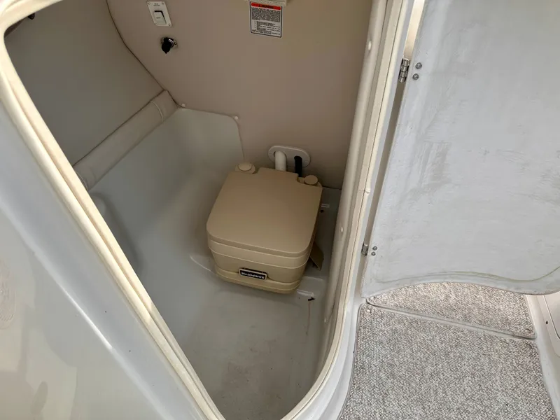 Slide: The Image of Interior of a 2005 Crownline 270 BR with portable toilet. - 23
