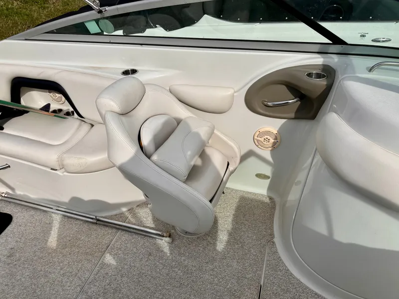 Slide: The Image of Interior of a 2005 Crownline 270 BR boat with white seating. - 26
