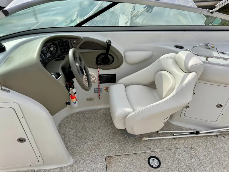 Slide: The Image of Interior of a 2005 Crownline 270 BR boat with steering console. - 27