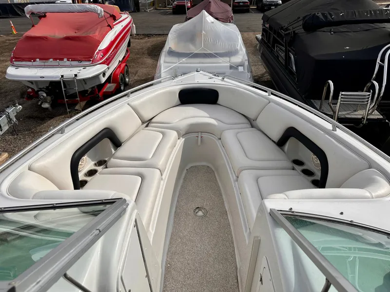 Slide: The Image of Interior view of a 2005 Crownline 270 BR boat with white seating. - 29