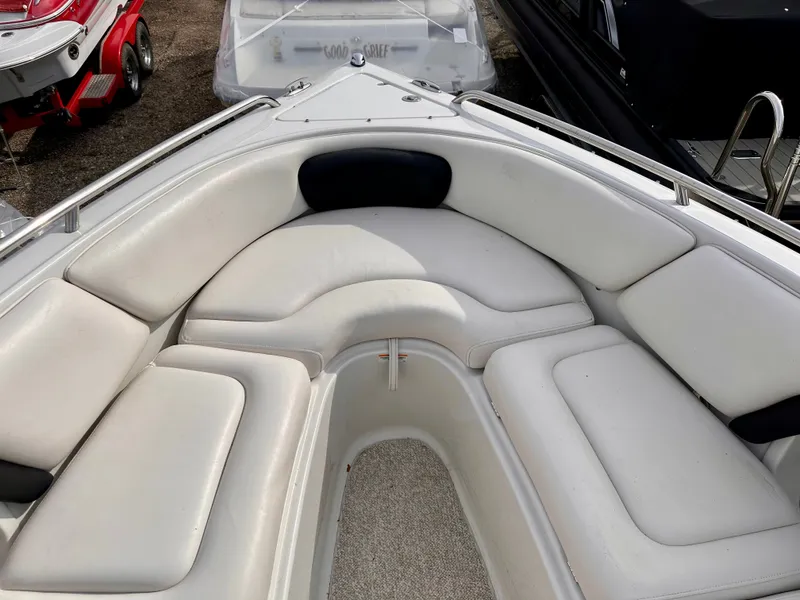 Slide: The Image of Interior view of a 2005 Crownline 270 BR boat with white upholstery. - 31