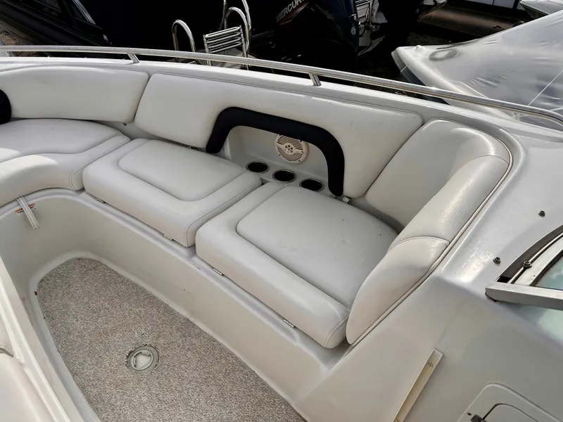 Slide: The Image of Interior of a 2005 Crownline 270 BR boat with white seating. - 32