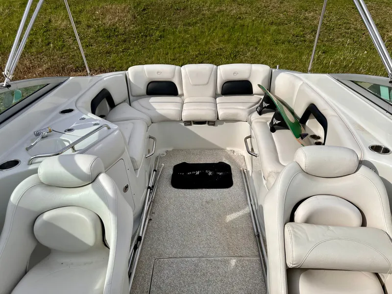 Slide: The Image of Interior of a 2005 Crownline 270 BR boat with white seating. - 34