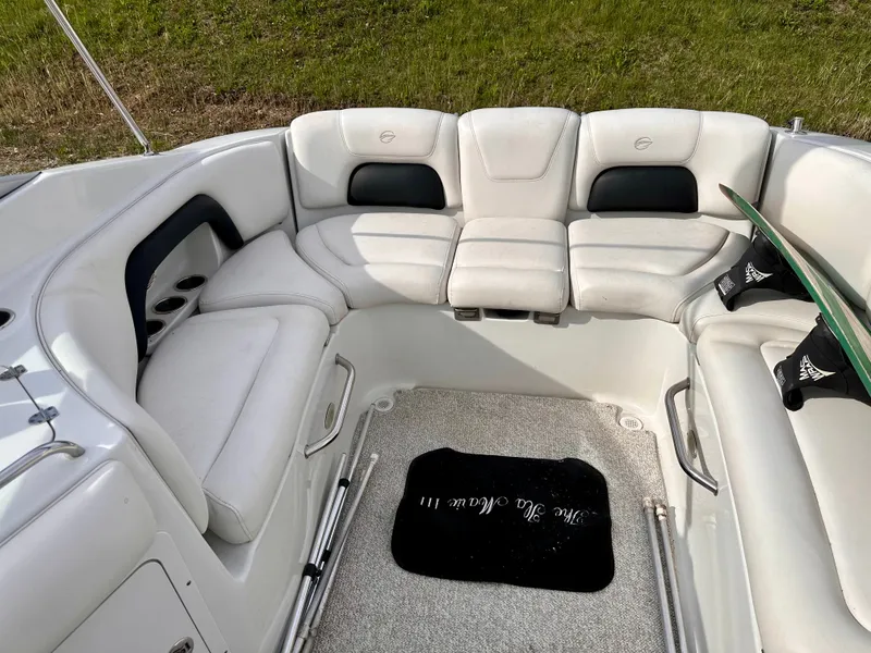 Slide: The Image of Interior of a 2005 Crownline 270 BR boat with white seating. - 36