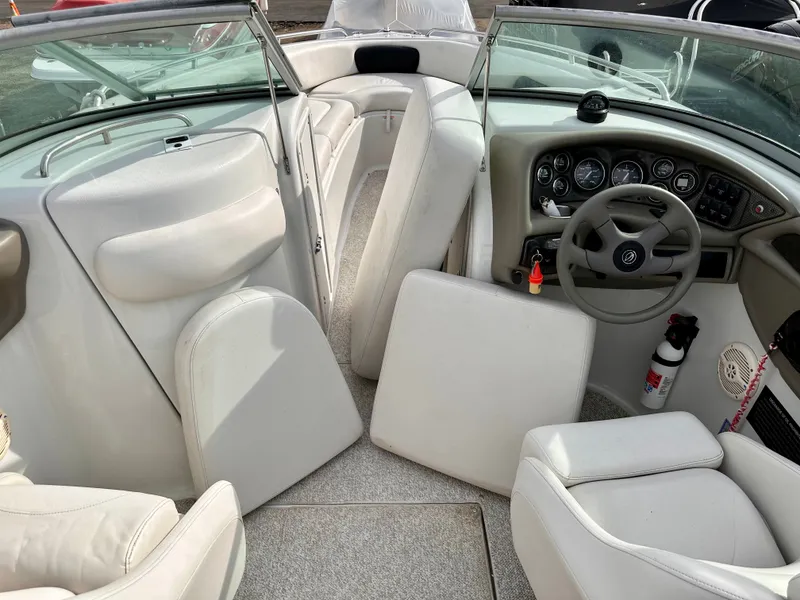 Slide: The Image of Interior of a 2005 Crownline 270 BR boat with steering console. - 38