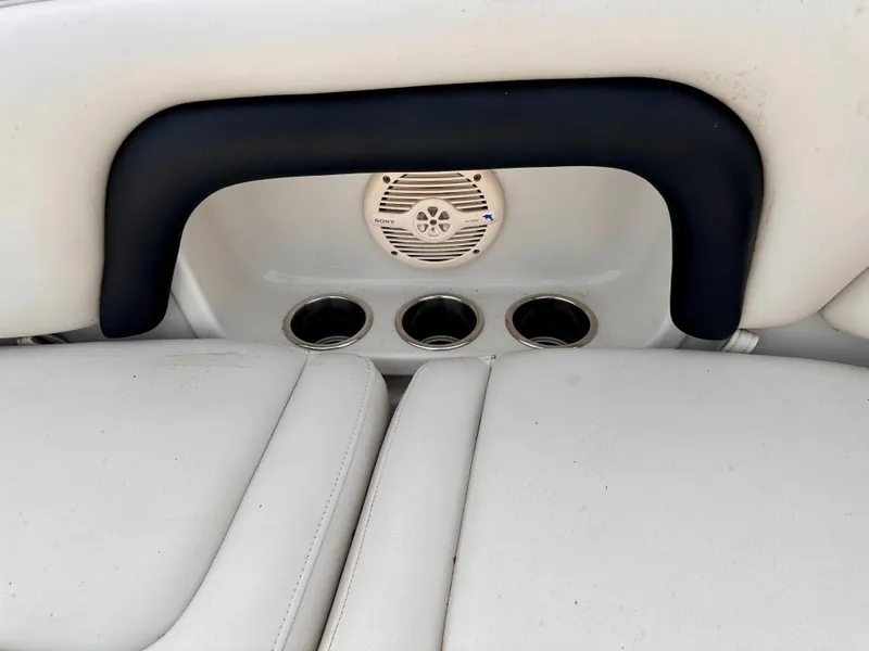Slide: The Image of Crownline 270 BR 2005 boat seat with speaker and cup holders. - 39