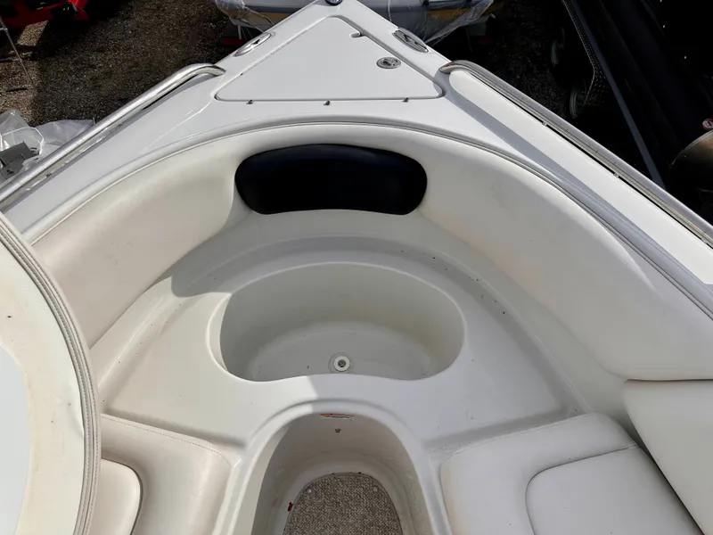Slide: The Image of Interior of a 2005 Crownline 270 BR boat, white upholstery. - 40